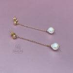 Orecchini pendenti perla bianca naturale in argento rosa